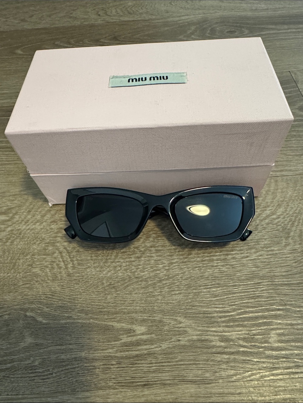 Miu Miu Glossy Black Cat-Eye Sunglasses